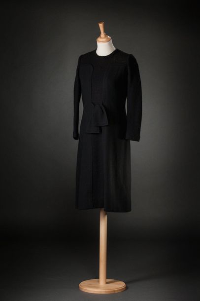 Madeleine de RAUCH Long sleeved black knit and jersey dress, closed in the back with...