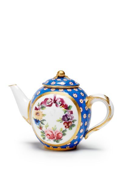 SÈVRES Small covered teapot in soft porcelain, with polychrome and gold decoration...