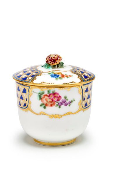 SÈVRES Covered sugar pot in soft porcelain, with polychrome decoration of bouquets...