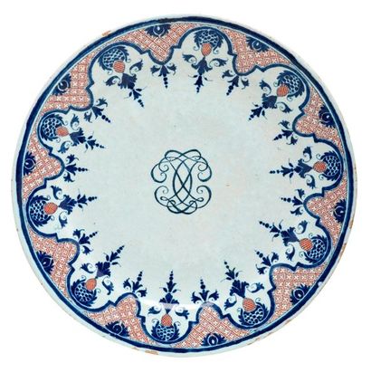 ROUEN Earthenware plate with plain rim, decorated with blue and red radiating iron...