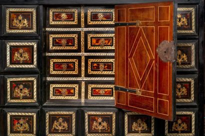 null *Ebony veneer and blackened wood molded cabinet with ivory inlaid decoration...