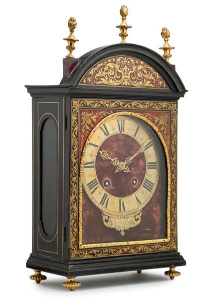 null Pendulum known as a religious clock in blackened moulded wood with inlaid decoration...