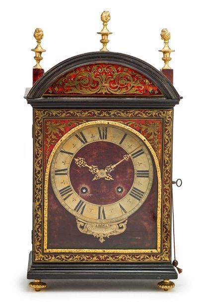 null Pendulum known as a religious clock in blackened moulded wood with inlaid decoration...