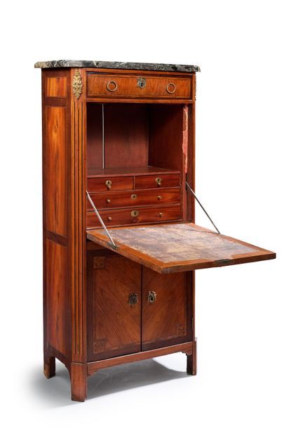 null Secretary made of veneer wood in frames. It opens by a drawer, a flap revealing...