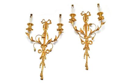 null Pair of chased and gilt bronze wall lights with two leafy light arms held by...