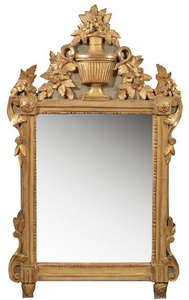 null Mirror with gilded stucco and gilded stucco gilded pediment, decorated with...