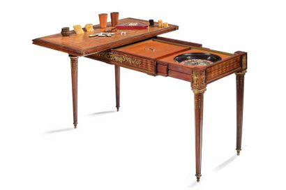 null Mahogany and mahogany veneer game table with diamond inlaid decoration. It opens...