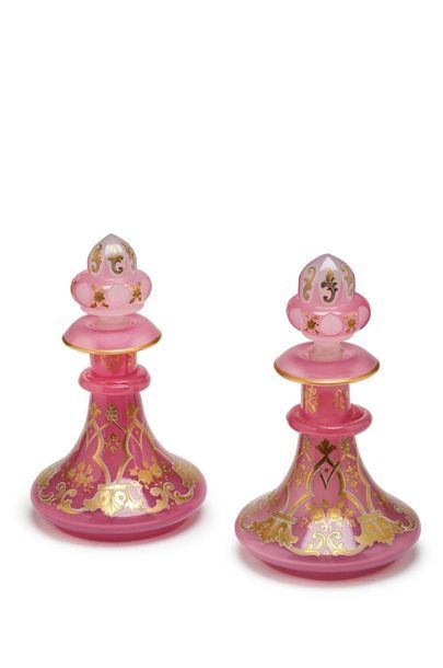 null Pair of flat-bellied pink, white and gold opaline bottles with Moorish decoration.
Mid...