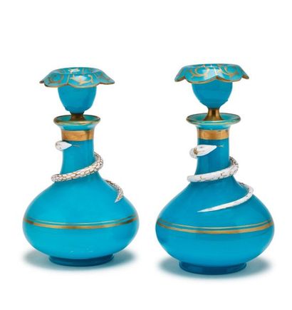 null Pair of flat-bellied blue and gold opaline bottles with a snake wrapped around...