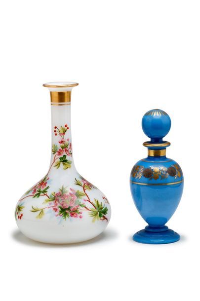 null Lot comprising
An ovoid bottle in lilac opaline and gold with a floral decoration....