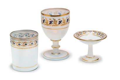 null Set including
a stemmed glass, a goblet and an empty-pocket bowl in white opaline...