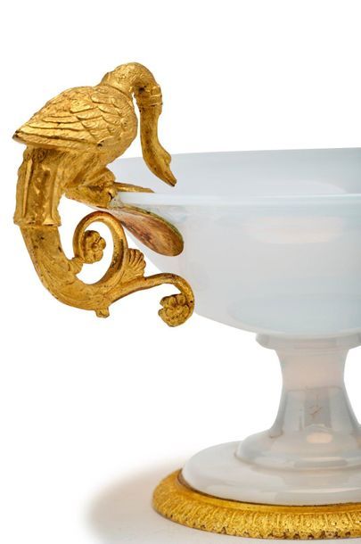 null Cut on a white opaline pedestal. Gilt bronze sockets representing two swans.
19th...