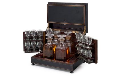 null Liquor cellar in blackened wood underlined with nets comprising 4 decanters...