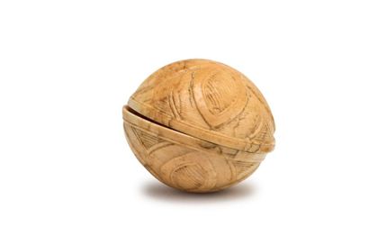 null *Flattened sphere in carved ivory with quadrilobal decoration opening by two...