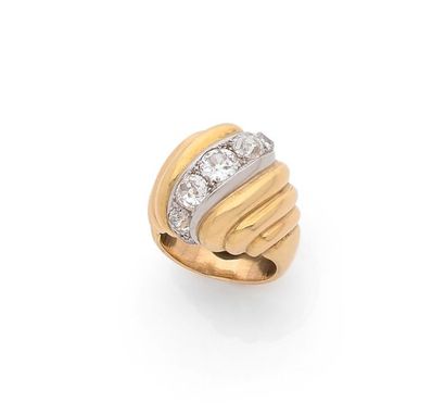 SUZANNE BELPERRON A "Torsade" ring in 750 thousandths yellow gold and 850 thousandths...