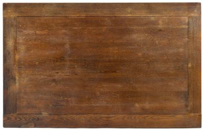 JEAN-CHARLES MOREUX (1892-1956) 
Oak dining table with rectangular top resting on...