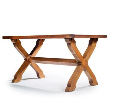 JEAN-CHARLES MOREUX (1892-1956) 
Oak dining table with rectangular top resting on...