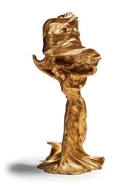 Raoul LARCHE (1860-1912) 
Loîe Fuller
Rare sculpture formant lampe en bronze doré.
Signée...