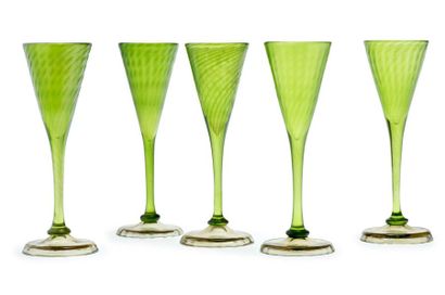 Émile GALLÉ (1846-1904) 
Suite of five glasses on a circular green-tinted glass pedestal
Signed...