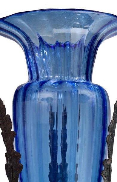 Carlo Rizzarda (1883-1931) 
Blue Murano "soffiati" glass vase encased in a wrought...