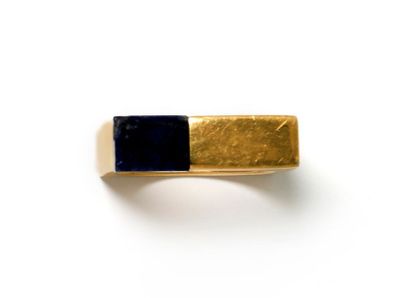 null Modernist gilded metal ring of square shape decorated with lapis lazuli in a...