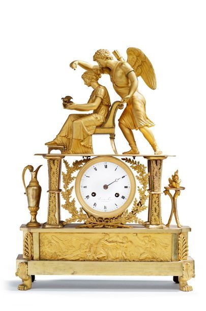 null A gilt bronze clock representing a young woman guided by Love, resting on an...