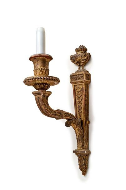 null Suite of four sculpted and gilded wood wall lights with a leafy arm of light...