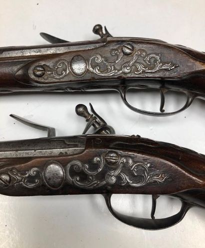 null Pair of flintlock pistols. Locks signed "Jean GOURGOULIAT" and flat-bodied swan-necked...