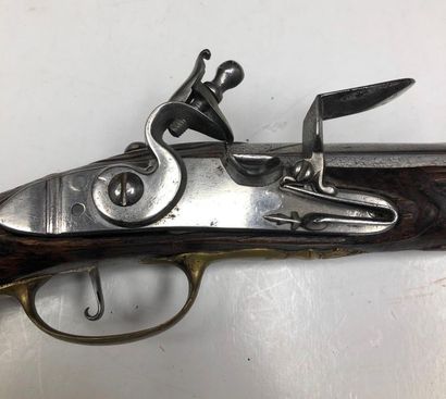 null Officer's flintlock pommel gun. Round barrel with flats on top. Lock and flat-bodied...