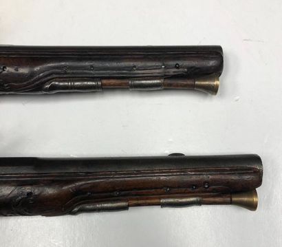 null Pair of flintlock pommel pistols. 
Round, flat and thunderbolt barrels, decorated...