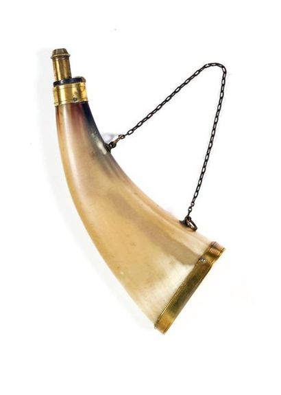null Powder horn, in clear horn with two hanger rings. 
Brass spout and fittings....