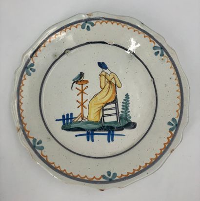 null Then five earthenware plates, flower decorations, fishing scene in a medallion,...
