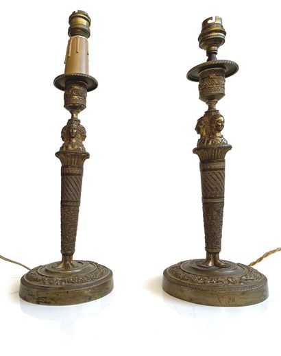 null Pair of gilt bronze torches decorated with three female busts, base decorated...