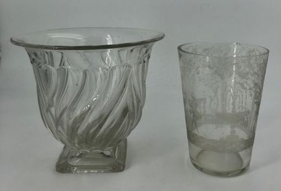 null Two engraved glass vases, one of which has a scene depicting two characters...
