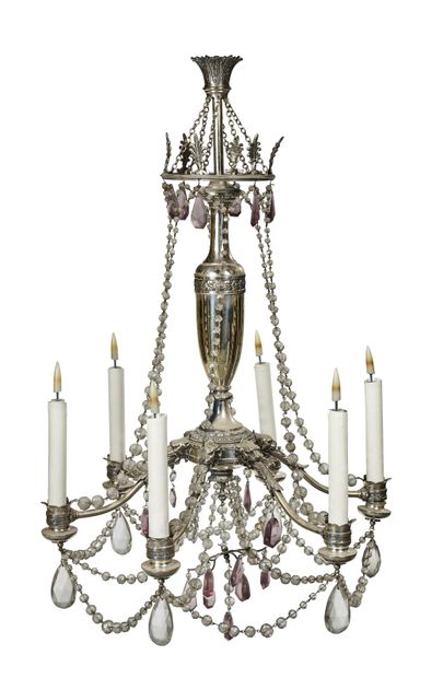 null A silver plated chandelier with 6 arms of light decorated with foliage and lion's...