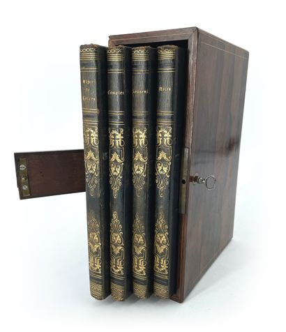 null Nice set of four books in their rosewood veneer case underlined by two light...