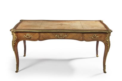 null Flat desk in wood veneer opening by three drawers on one side, ormolu ornamentation....