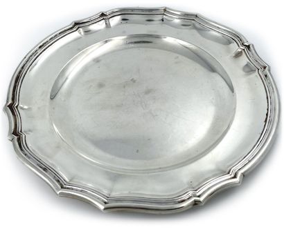 null A round silver dish with a curved edge.
Goldsmith : Puiforcat in Paris. Minerve...