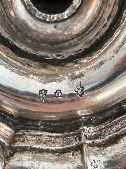 null Pair of silver candlesticks with a scalloped base, umbilicus engraved with a...