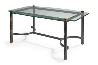 JACQUES ADNET (1900-1984) 
Dining room table with thick glass slab top resting on...