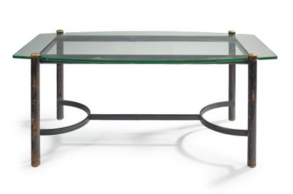 JACQUES ADNET (1900-1984) 
Dining room table with thick glass slab top resting on...