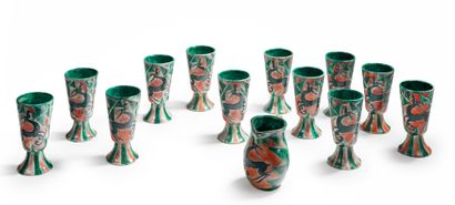 Edouard CAZAUX (1889-1974) 
Set of twelve mazagrans and a polychrome enamelled ceramic...