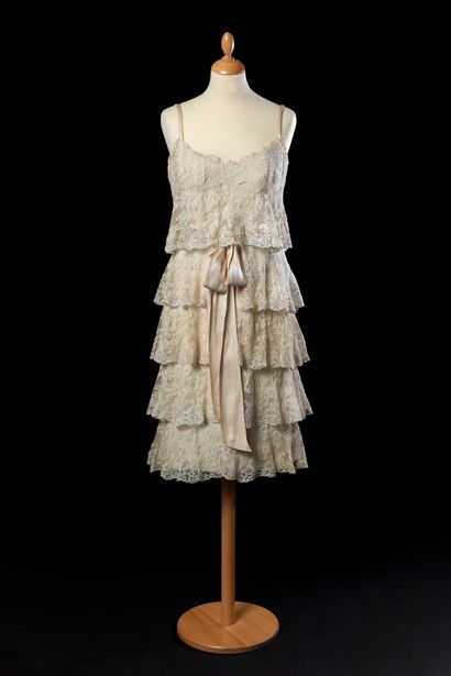 Guy LAROCHE 
Short ivory cocktail dress with thin satin straps, decorated with five...