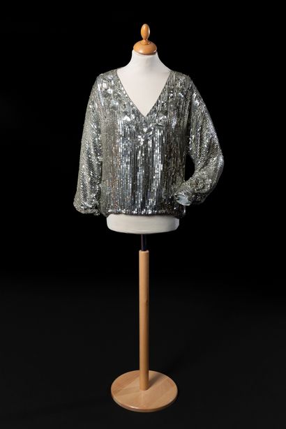 Christian DIOR Boutique 
Two-piece including a blouse embroidered with silver sequins...