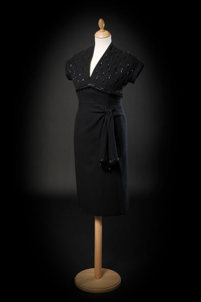 Madeleine de RAUCH 
Black flannel dinner dress with jet embroidered top. High waist...