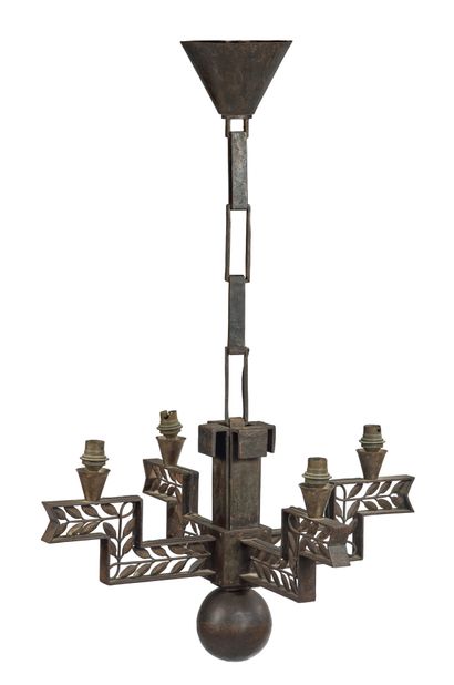 Edgar BRANDT (1880 1960) 
A four arms hammered wrought iron chandelier with an openwork...