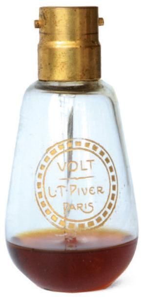 L.T PIVER « Volt ». Flacon en cristal figurant une ampoule électrique à baïonnette,...