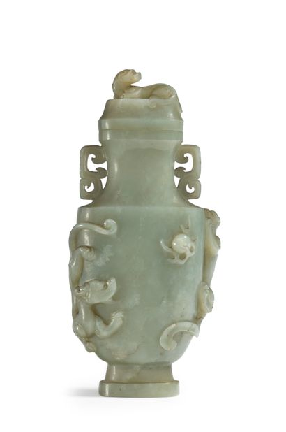 CHINE - XIXe siècle A celadon nephrite covered vase on a pedestal with carved decoration...