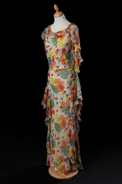 null 
Summer evening dress with a gathered boat neckline, in silk chiffon printed...
