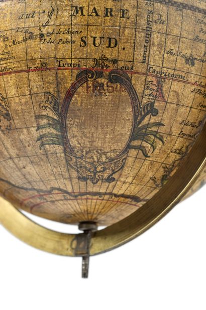 null 
Globe captioned mainly in Latin. It rotates in its brass meridian circle with...